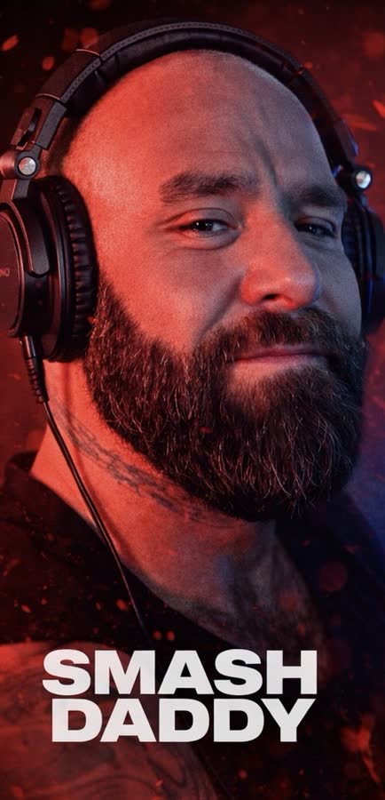 Smash Daddy, headphones on, under red light